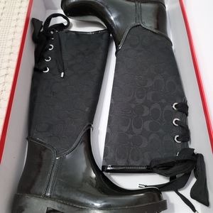 Women COACH rainboots with ties on back. Black Size 6